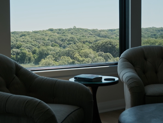 sitting area overlooking view in a custom home in Port Jefferson, NY