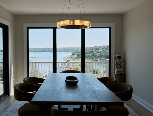 dining table overlooking water view in a custom home in Port Jefferson, NY
