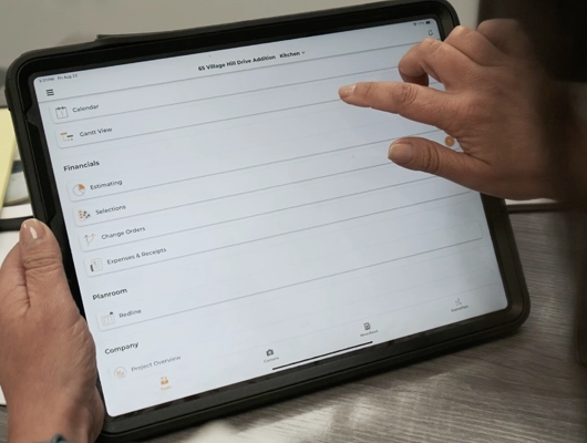 woman holding a tablet and looking through files