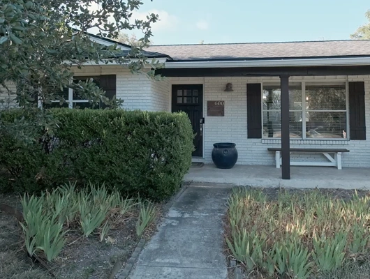 black and White House with landscaping