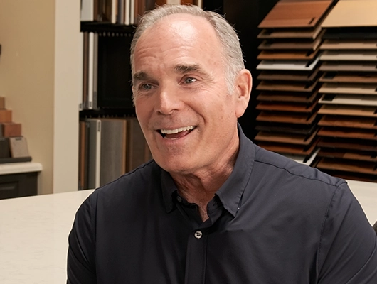 older man in black button down shirt