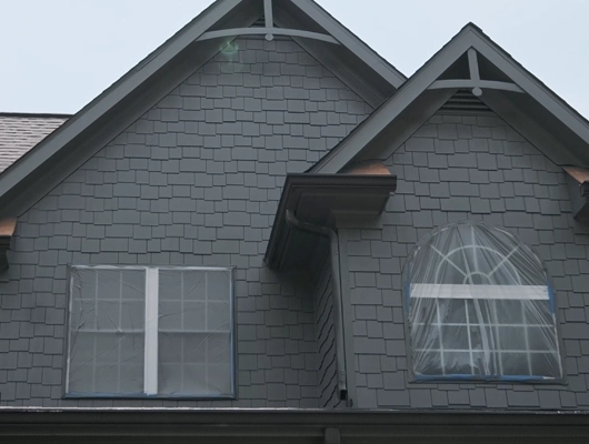 exterior view of a dark painting house