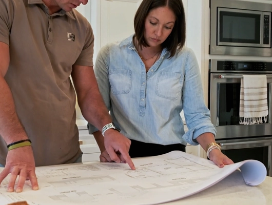 custom home builder looking at plans