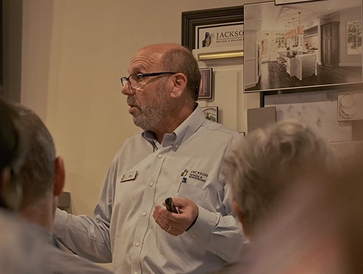 man giving a speech in front of people