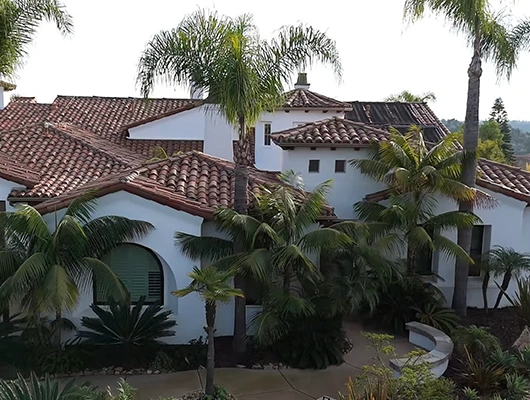 white California home with red roof