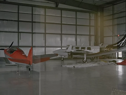 two airplanes in a hanger