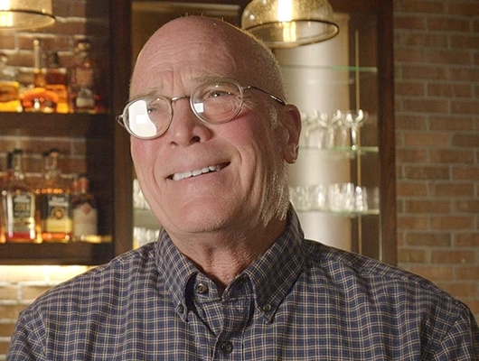 homeowner sitting in front of bar