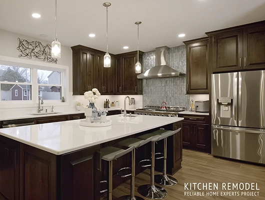 remodeled kitchen with dark stained cabinetry and large island